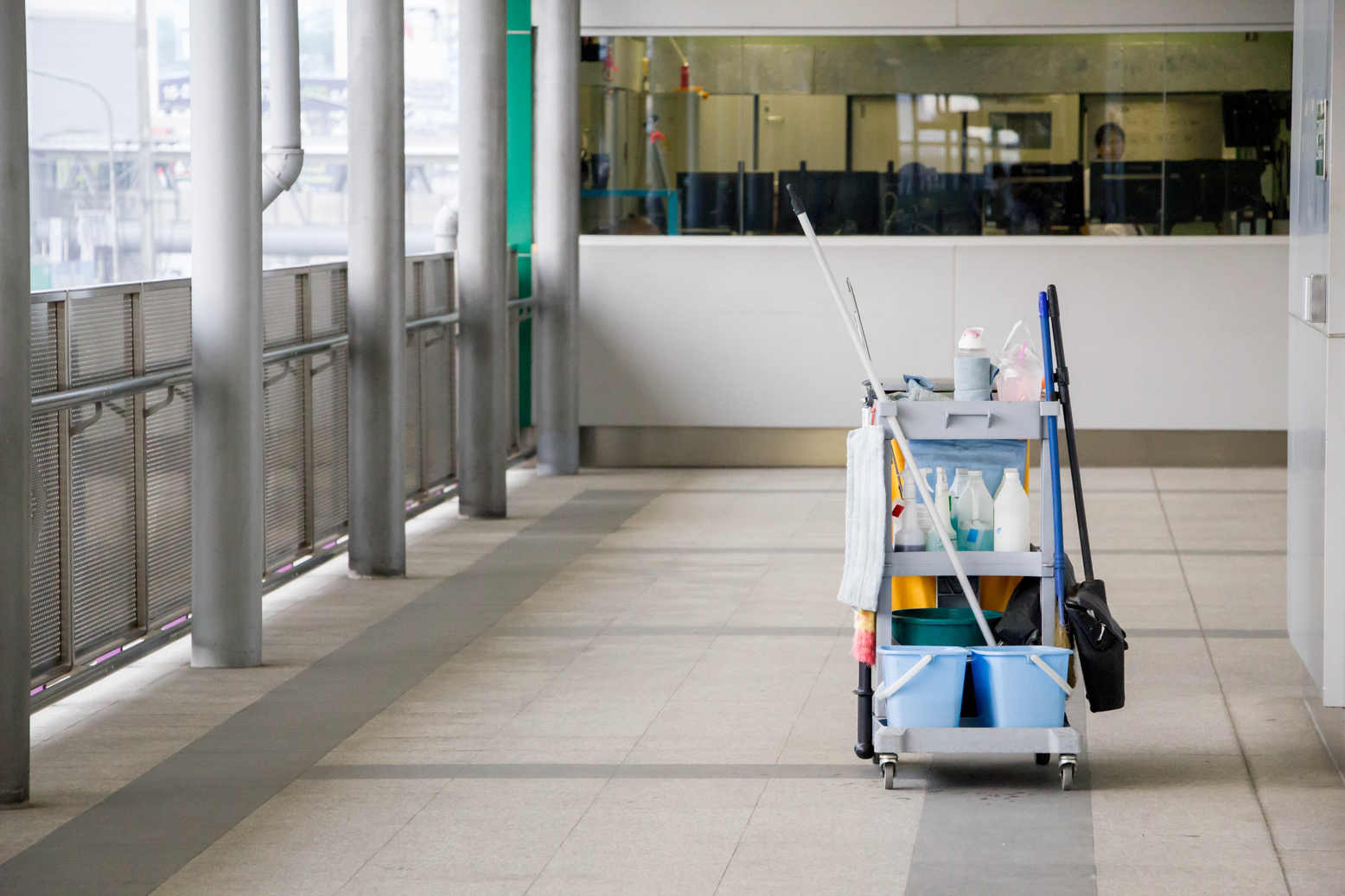 Cleaning equipment in cart on the floor.